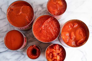 How is tomato paste made commercially